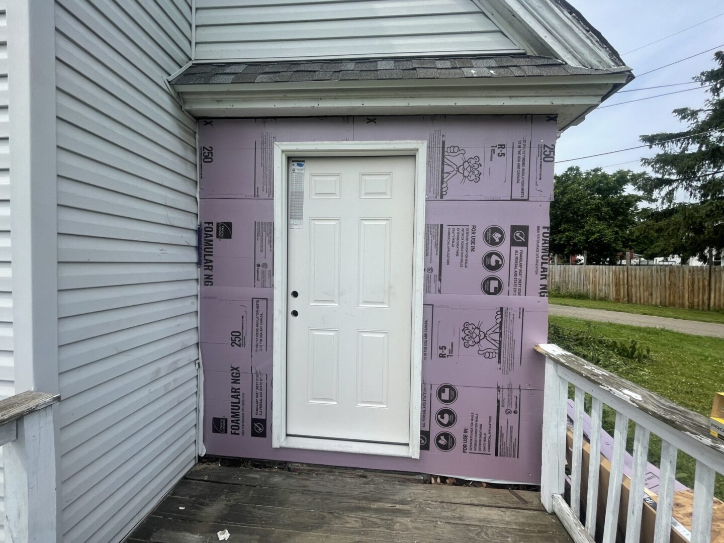 A door that is covered in purple paper.